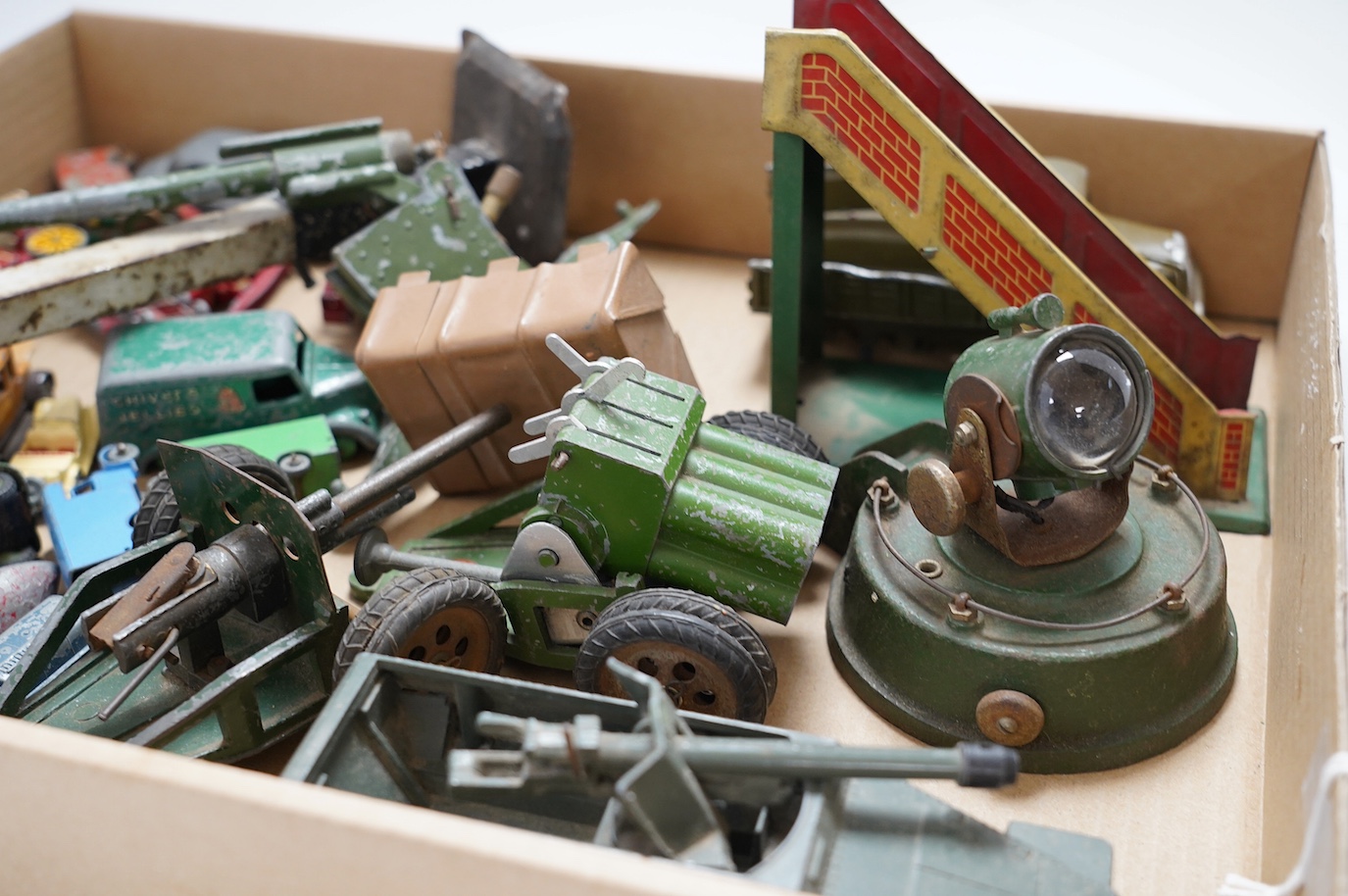 A collection of diecast toys, including an early Britains half-track army troop transporter, Matchbox vehicles, an Astra field gun, etc. Condition - poor